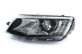 SKODA Headlight; Left; Black;Xenon